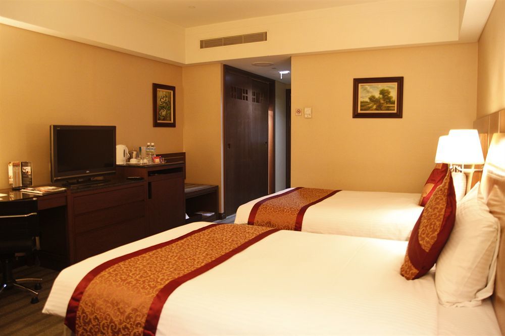 Evergreen Plaza Hotel - Tainan Extérieur photo Deluxe Room